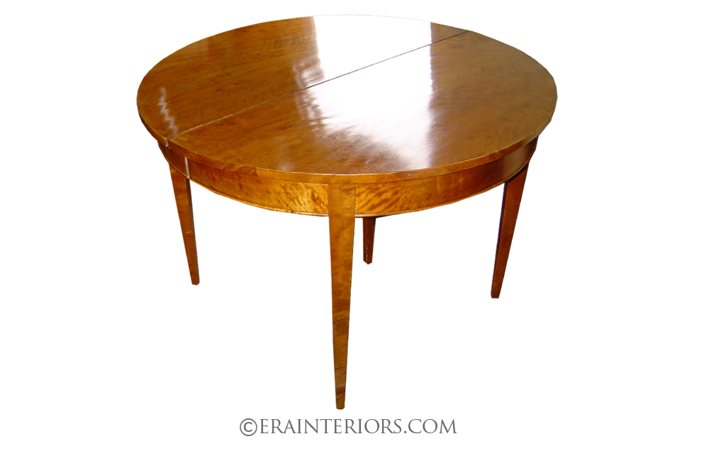 neoclassical round dining table with tapered legs